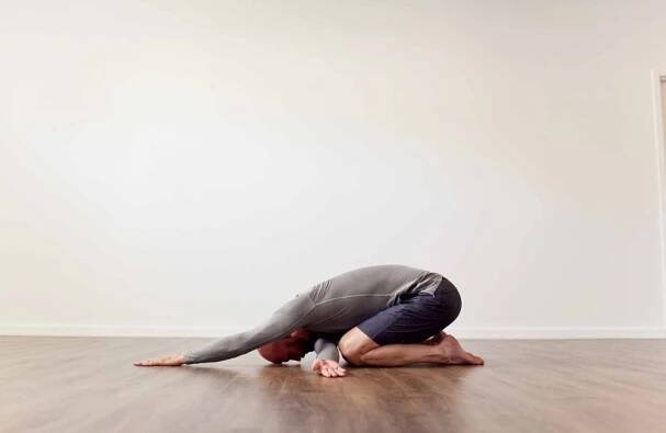childs pose with shoulder stretch