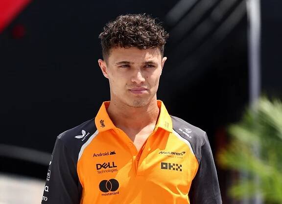 Lando Norris in McLaren Formula 1 team polo shirt.