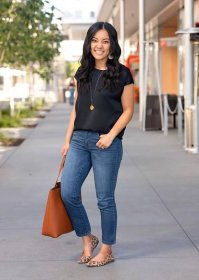 Elevated Casual Outfit with Comfy Bottom for Spring and Summer: black short sleeve top + medium wash straight leg cropped jeans + gold long pendant necklace + animal print flats + cognac tote bag side view