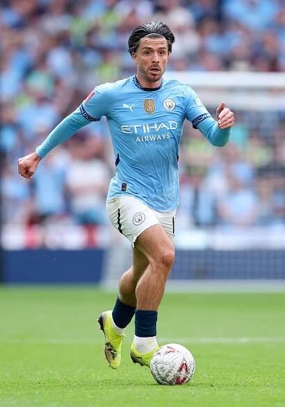 Jack Grealish of Manchester City controlling the ball during a soccer match.