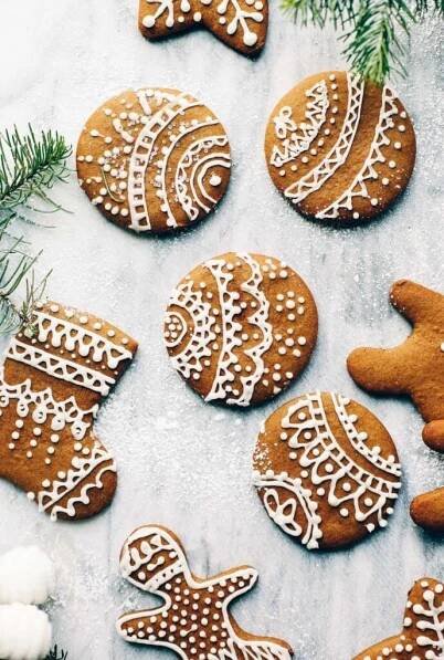 ginger cookies decorated with white icing and christmas decorations