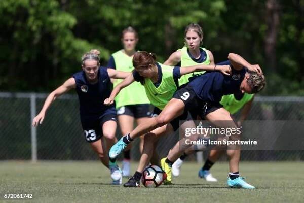 Yuri Kawamura and Lynn Williams challenge for the ball as Kristen Hamilton and McCall Zerboni join the play. The North Carolina Courage held a...