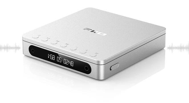 A sleek silver electronic device, the Fiio DM13 features a digital display and several buttons on the front, providing a modern touch.
