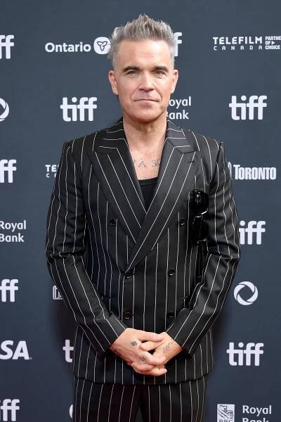 Robbie Williams at an event for Better Man (2024)