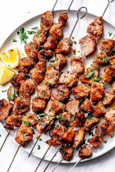 Pork Souvlaki on skewers on platter