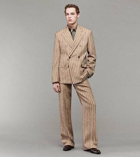 Model wearing Pinstripe Double-Breasted Tailored Jacket and Tailored Trousers in Biscuit and Canopy