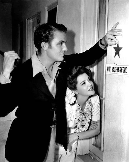 BADLANDS OF DAKOTA, Robert Stack, nailing a star to costar Ann Rutherford's dressing-room door, 1941