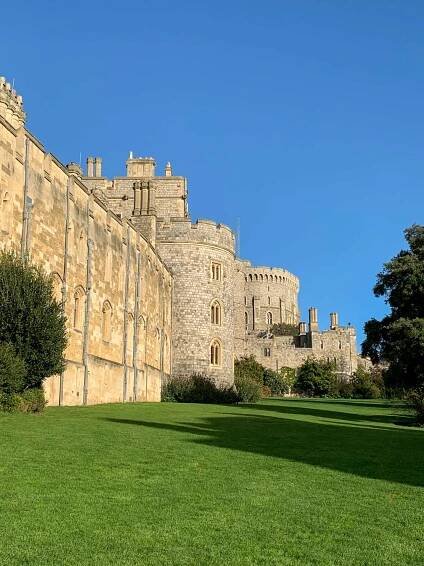 A view of Windsor Castle from the road outside the Castle. The Castle is pictured beneath a clear blue winter sky