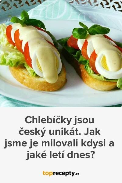 two sandwiches with lettuce, tomato and mayonnaise are on a white plate