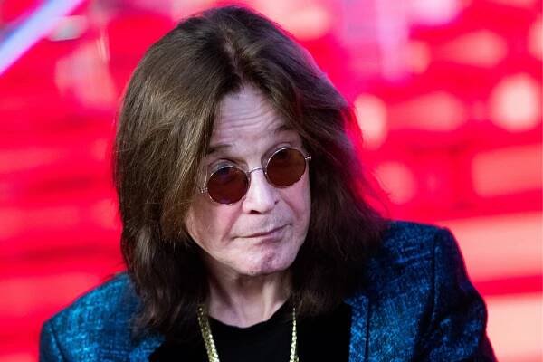 Ozzy Osbourne signing his personalized star at the Moscow Walk of Fame.