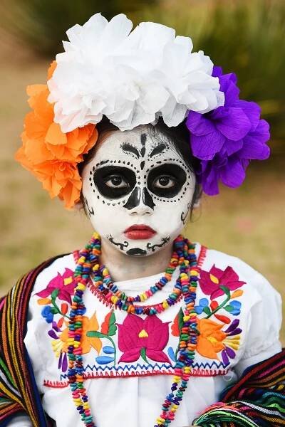 Child with makeup for  dio de los muertos in Oaxaca, Mexico