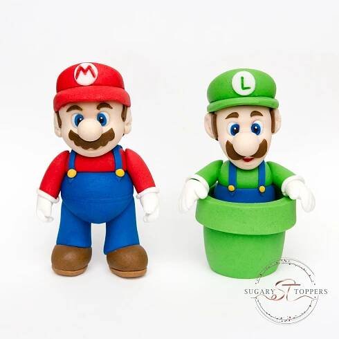 two toy figurines made to look like mario and luigi