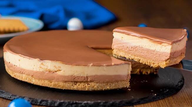 a chocolate cheesecake is cut into pieces on a plate