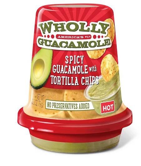 a container of guacamole with tortilla chips
