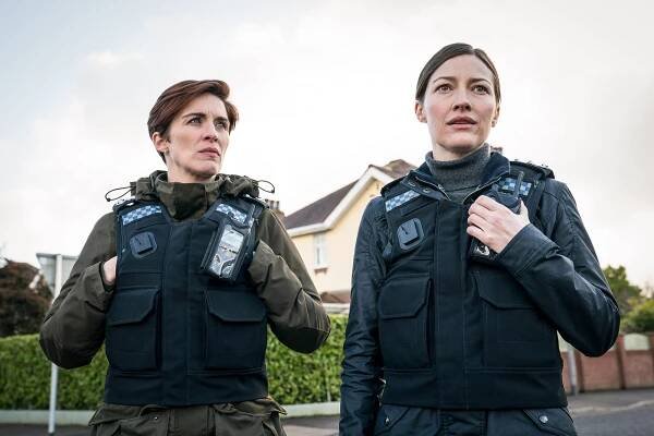 Photo of Vicky McClure and Kelly Macdonald wearing police uniforms in a scene from "Line of Duty."