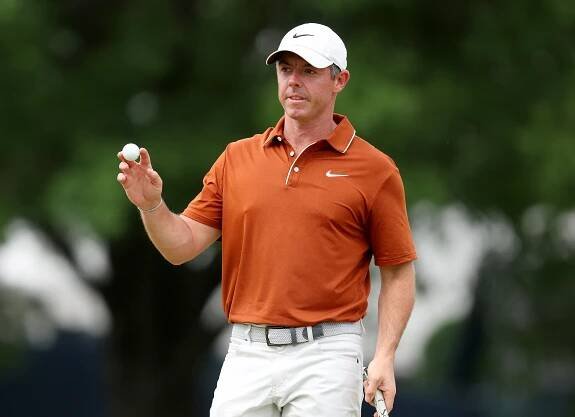 Rory McIlroy, who made the cut at the number at 1-over, acknowledges the fans after making a putt on the 10th hole during the second round of the PGA Championship.
