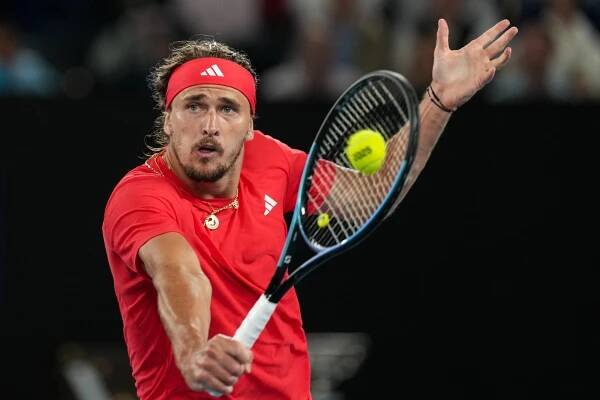 Alexander Zverev playing a backhand in a tennis match.