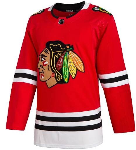 The front of a red authentic Chicago Blackhawks jersey for sale at Gunzo's in Chicago