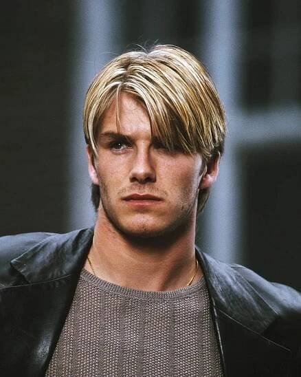a man with blonde hair and a leather jacket