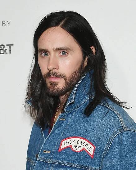 Image may contain Jared Leto Clothing Apparel Face Human Person Pants Jacket Coat Denim and Jeans