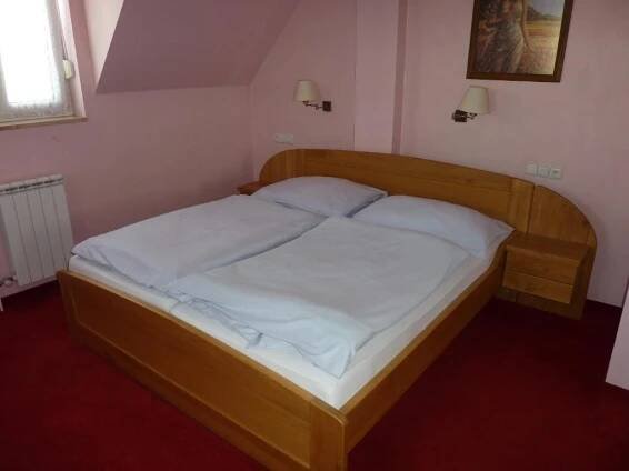Postel nebo postele na pokoji v ubytování Hotel & Restaurant Na Fryštátské