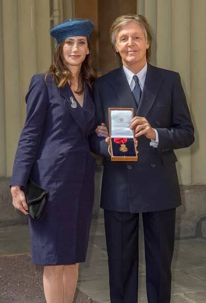 Paul McCartney and his wife Nancy Shevell pose following an Investiture ceremony, where he was made a Companion of Honour at Buckingham Palace on May 4, 2018 in London, England