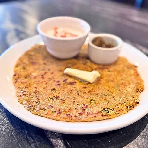 Stuffed Indian flatbread with crumbled paneer