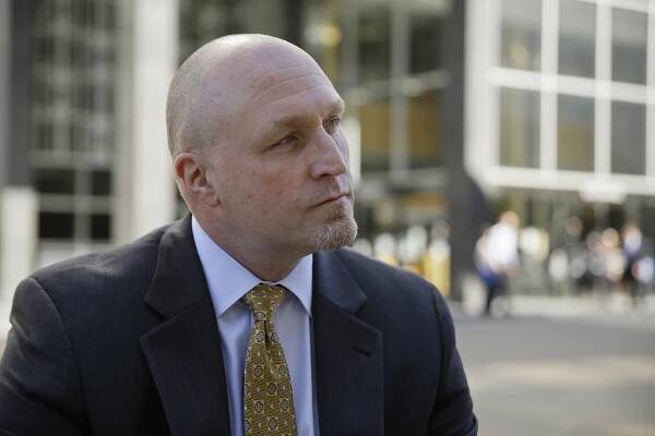 In this photo taken Tuesday, Sept. 27, 2106, FBI Special Agent John Bennett listens to a question while posing outside his office in San Francisco. The FBI’s new leader in San Francisco is a former drug investigator who developed expertise in technology that put him at the center of the government’s effort to unlock an iPhone used by one of the San Bernardino shooters. Bennett now has oversight responsibilities for Silicon Valley. (AP Photo/Eric Risberg)