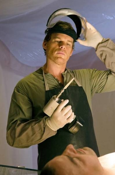 Michael C. Hall in Dexter, Season 8, Episode 1, holding a power tool while wearing protective gear.
