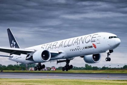 An Air China Boeing 777-300ER in Star Alliance Livery about to land.