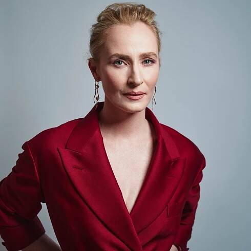 Image may contain Genevieve O'Reilly Clothing Coat Blazer Jacket Formal Wear Suit Adult Person Dress and Face