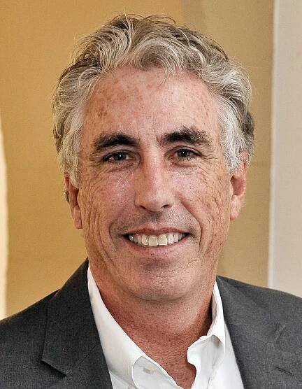 casual headshot of John Aubrey Douglass