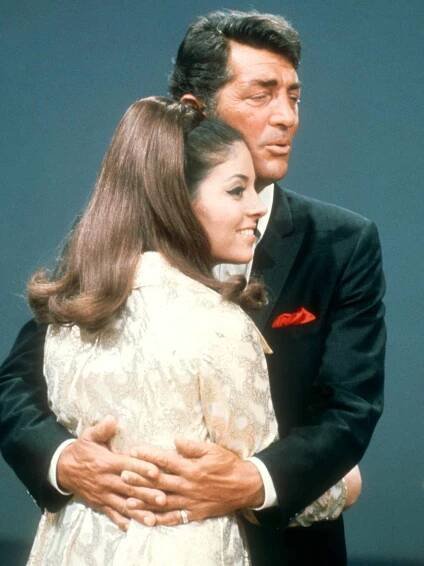 Dean Martin (1917-1995) performs with his daughter Gail Martin on the set of 'The Dean Martin Show' Christmas special in 1967 in Los Angeles, California