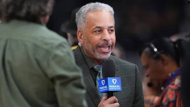 Charlotte Hornets television analyst Dell Curry in the first half of an NBA basketball game...