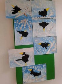 four pictures of birds in the sky with clouds and stars on them, all made out of paper