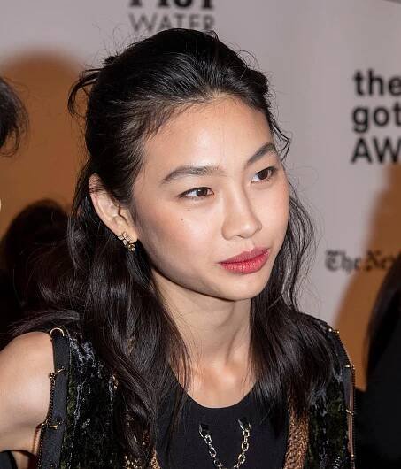 HoYeon Jung attends the 2021 Gotham Awards in a velvet-accented Louis Vuitton ensemble, showcasing her chic partnership with the iconic fashion house