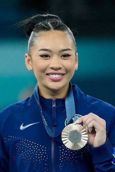 Sunisa Lee of the United States poses with her bronze medal during the Women's All-Around Final on day six of the Olympic Games