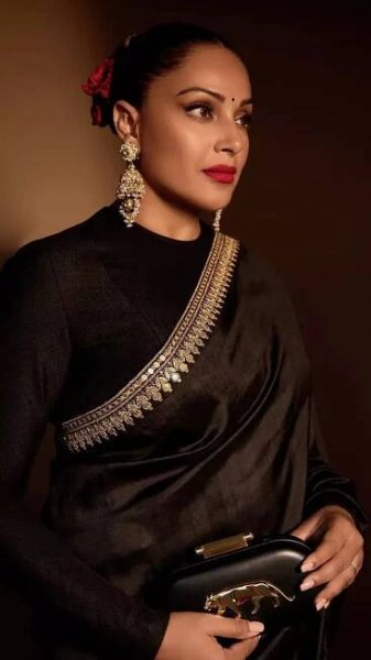Bipasha Basu captivates in a timeless black satin saree