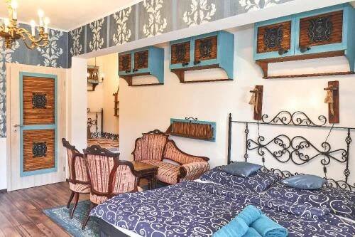 a bedroom with a bed and a table and chairs at Apartmán MIKU-LOVE in Mikulov