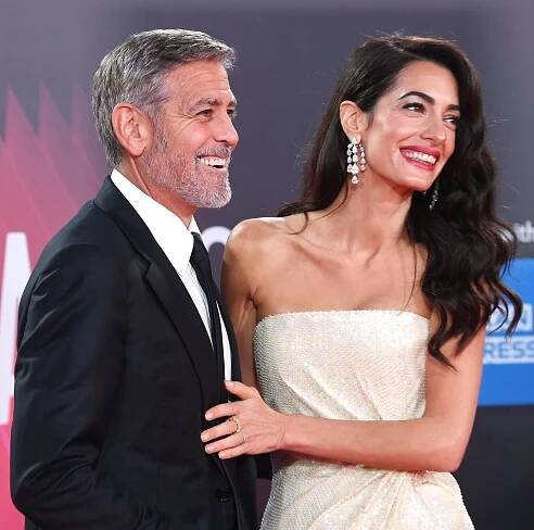 George Clooney Helps Amal Avoid Wardrobe Malfunction on Red Carpet