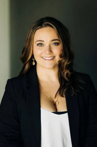 Pretty realtor posing for her studio headshots in downtown Sarasota taken by Sarasota photographer hair and makeup.