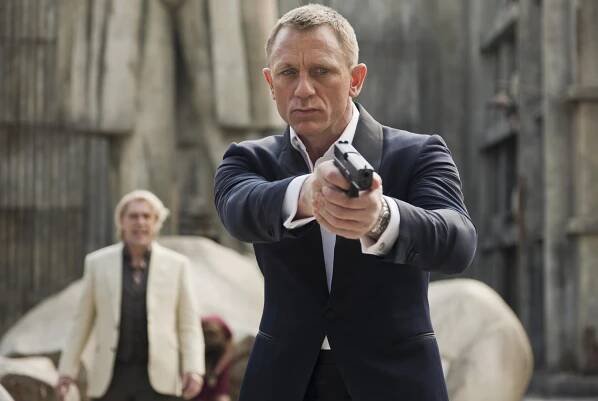 Scene still from Skyfall, featuring Daniel Craig aiming a gun.