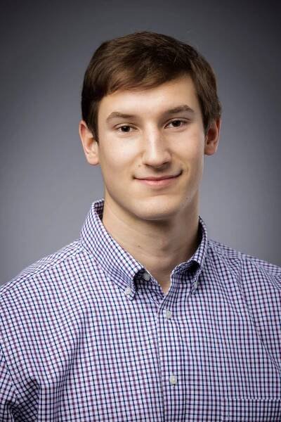 young man in plaid shirt 