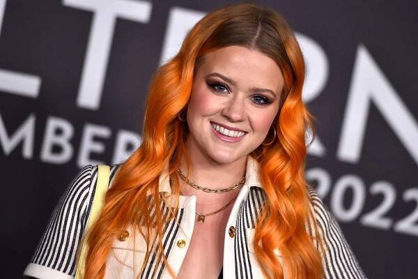 Ava Phillippe Sports Bright Orange Hair and Bikini Top at Celine Runway Show in LA