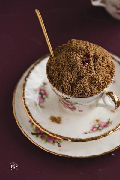 Gujarati chai masala placed in a tea cup with a spoon