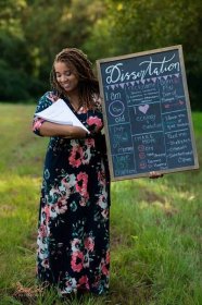 Florida Woman Poses with Dissertation in 'Maternity' Photo Shoot: 'I Got My Baby!'