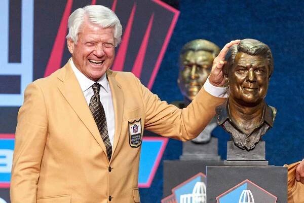 Class of 2020 member Jimmy Johnson celebrates with a bust of Johnson during the Pro Football HOF Centennial Class of 2020 enshrinement ceremonies on August 7, 2021 at Tom Benson Hall of Fame Stadium, in Canton, OH.