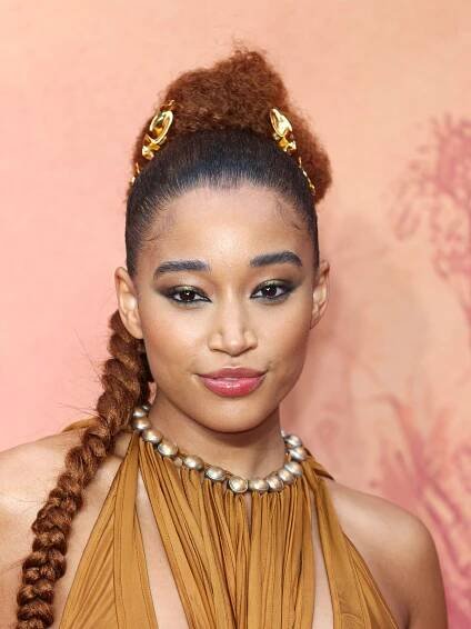Amandla Stenberg on the red carpet for the Star Wars The Acolyte UK Premiere with their hair in a long braid wearing a...