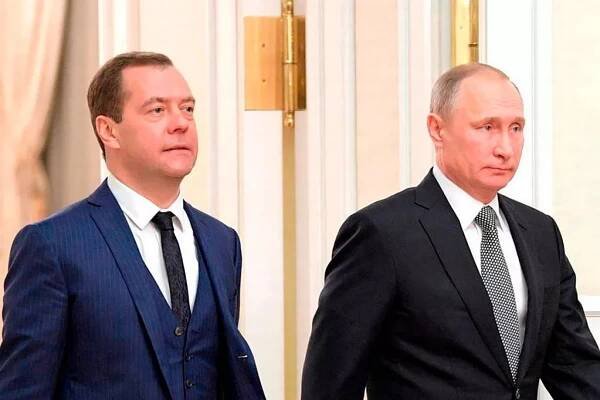 Sergei Shoigu (L) pictured walking with Vladimir Putin