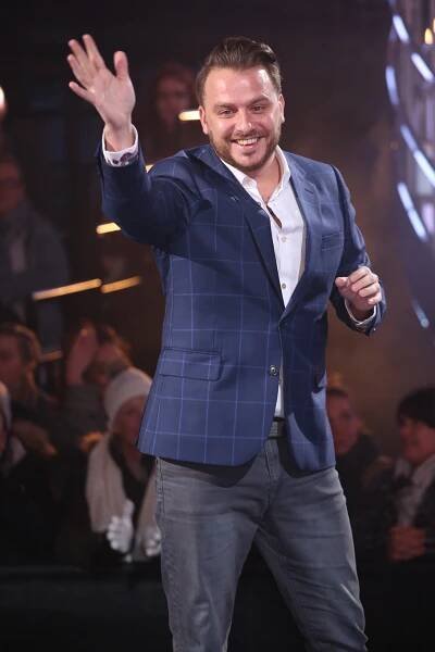 Daniel O'Reilly waving at a Celebrity Big Brother eviction.